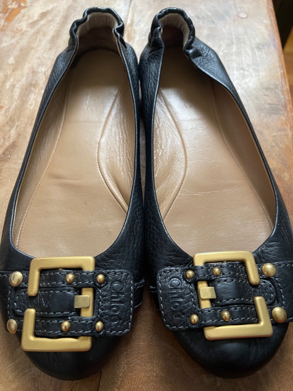 Chloe Black Leather Ballet Flats with Gold Buckle Accents